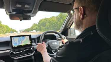 Dacia Duster Journey Hybrid long-term - over the shoulder driving